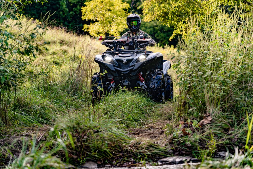 Hunter riding an ATV