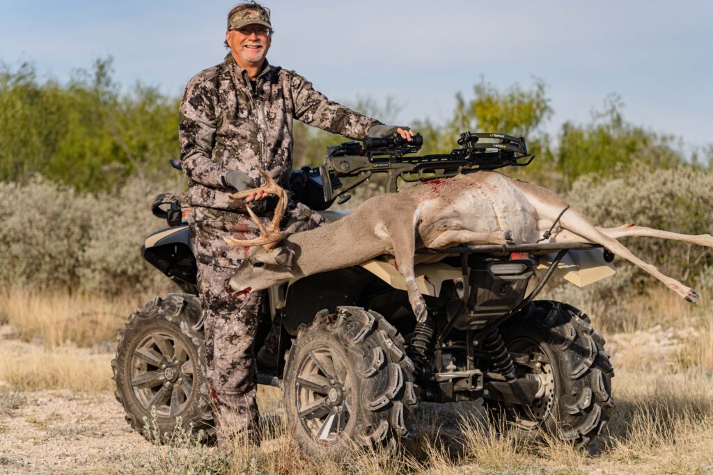 Hunter with TenPoint Viper 430 Crossbow and Whitetail Buck on Yamaha ATV