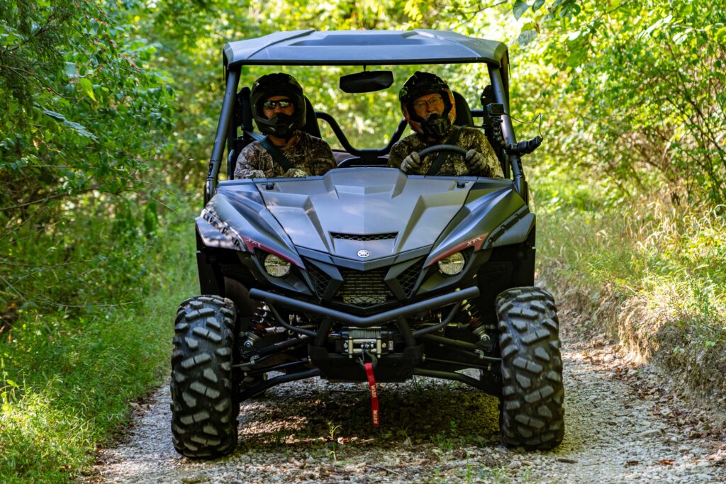 Hunters riding in SxS to go deer hunting