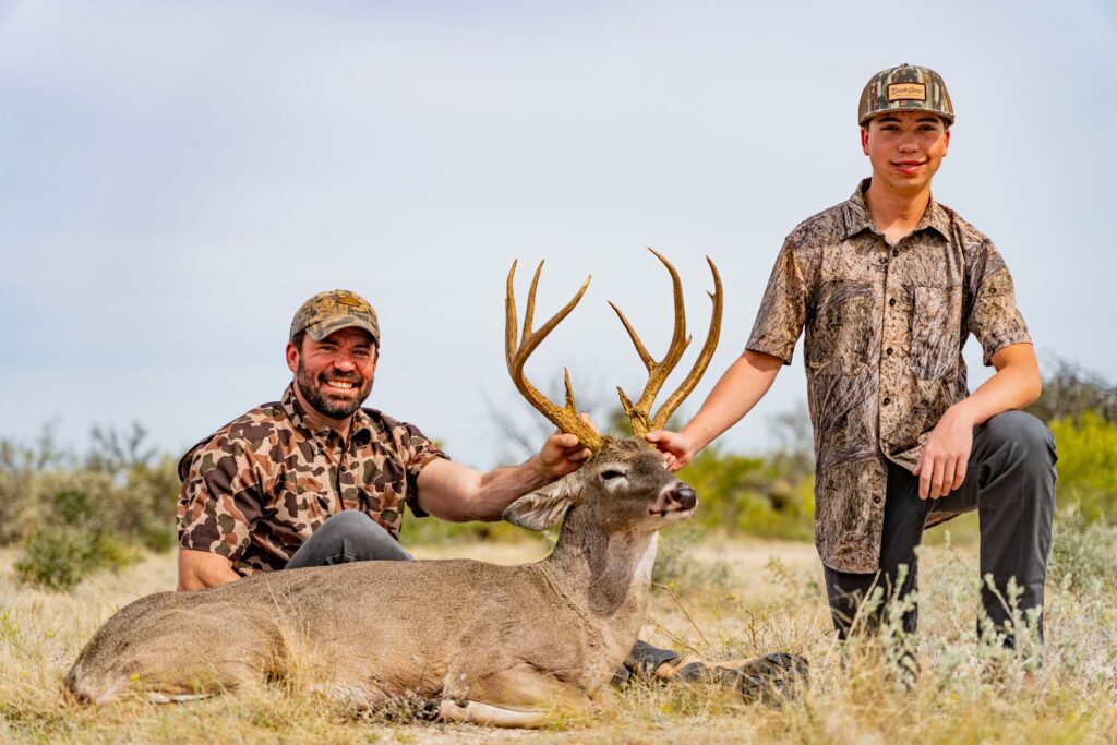 Father & Son with a Double Main-Beamed Whitetail Buck
